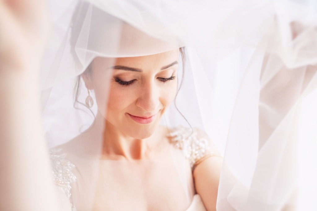 bride wearing veil 20 Old-Fashioned Wedding Traditions That Nobody Does Anymore