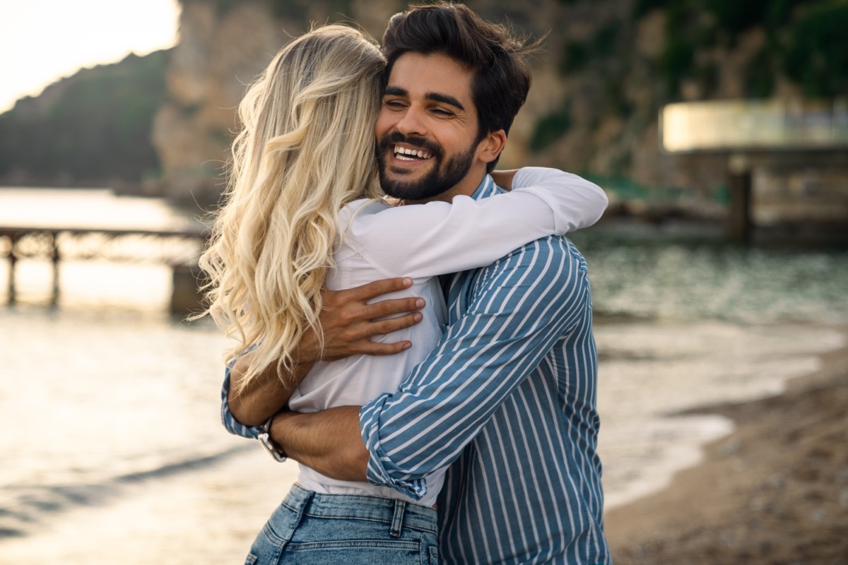 man hugging a woman