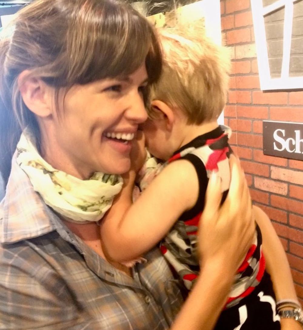 Jennifer Garner holding one of her children