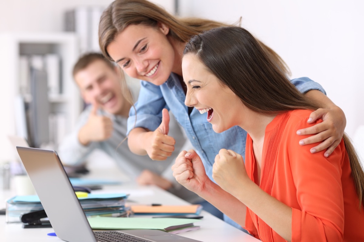 woman congratulating her coworker