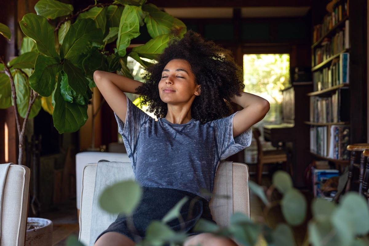 Young and stress-free american woman enjoy some time in her house in Los Angeles, California.