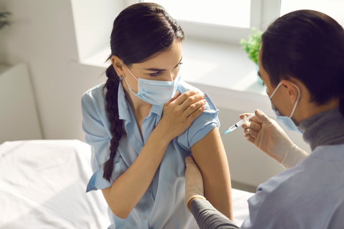 Woman getting COVID vaccine