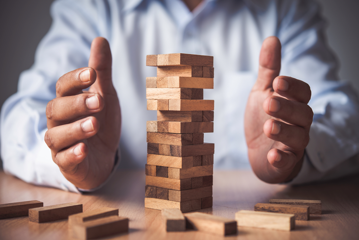 Person carefully playing Jenga