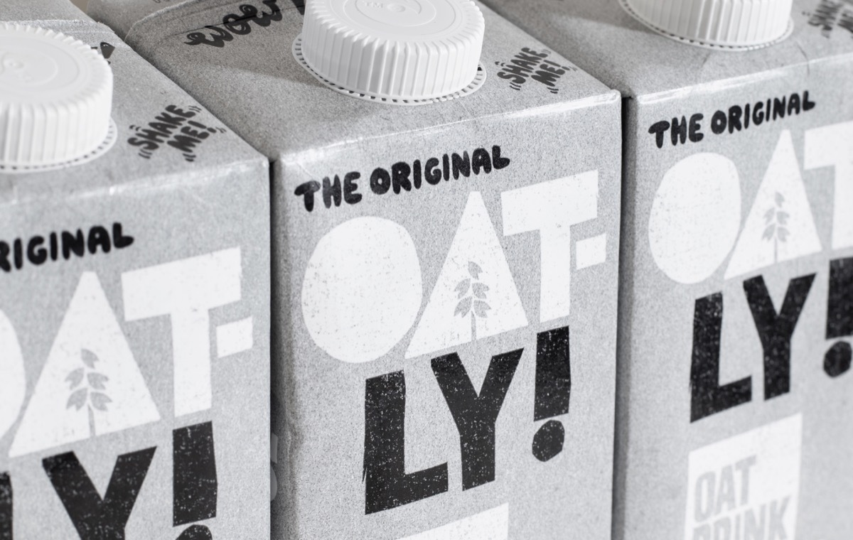 London UK - March 8th 2021 - Oatly milk cartons macro closeup. Oatly is a dairy free vegan milk alternative.