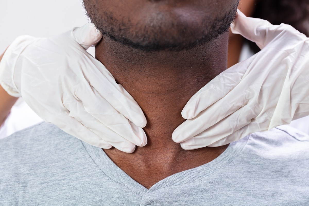 Doctor checking patient's gland