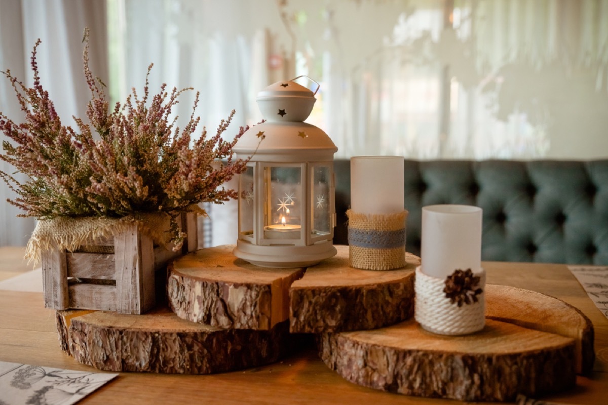 led candles on pieces of a chopped log