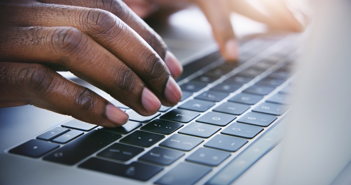 Shot of a businessman using his laptop at the office