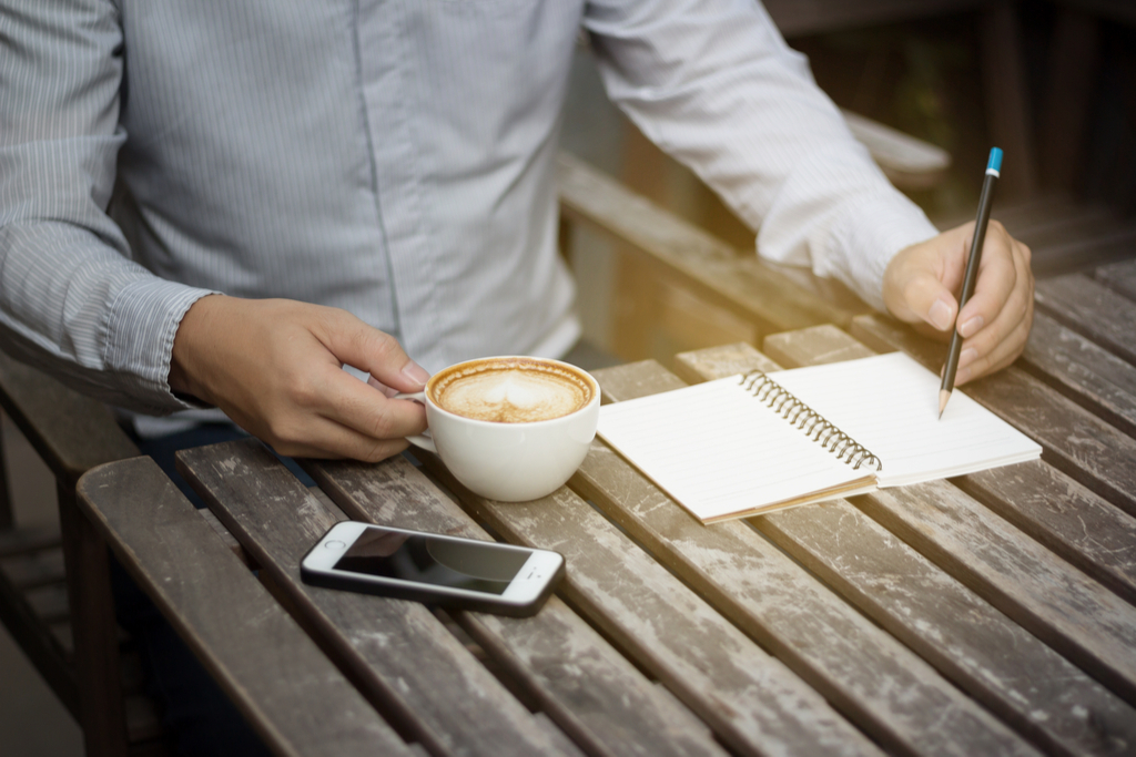 Man Drinking Coffee and Writing Valentine's Day