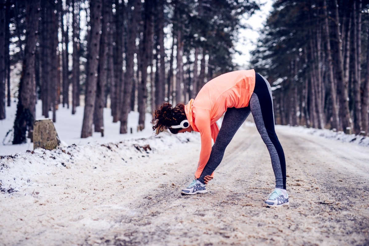 woman stretching in the winter