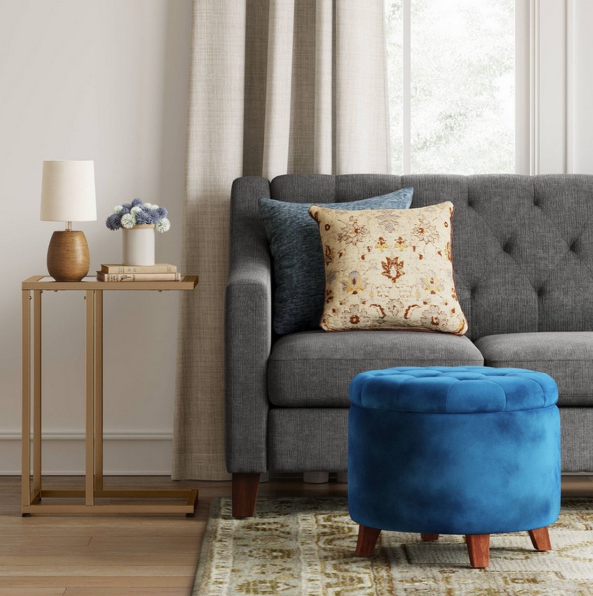 living room with blue tufted ottoman