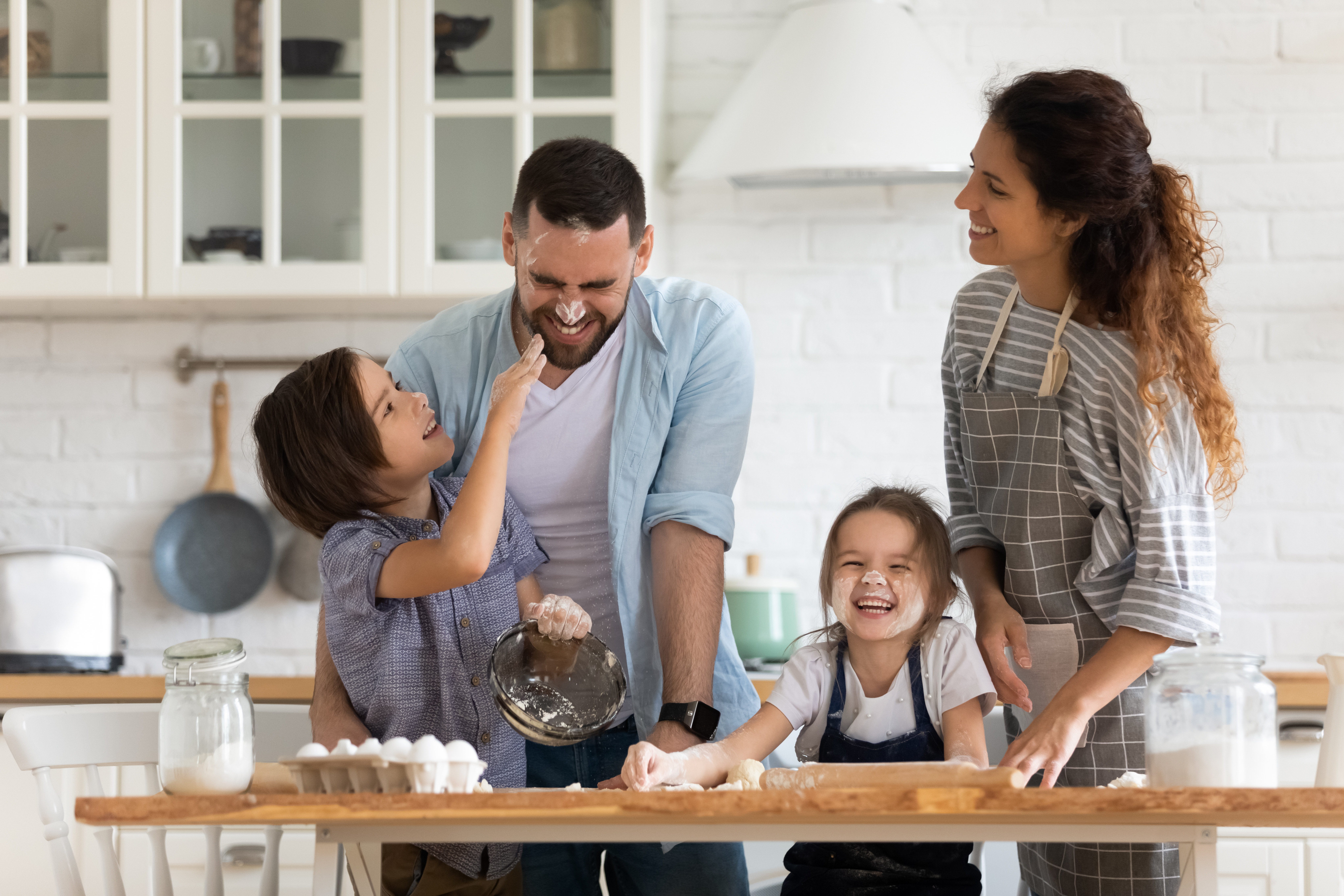 family having fun together in the kitchen