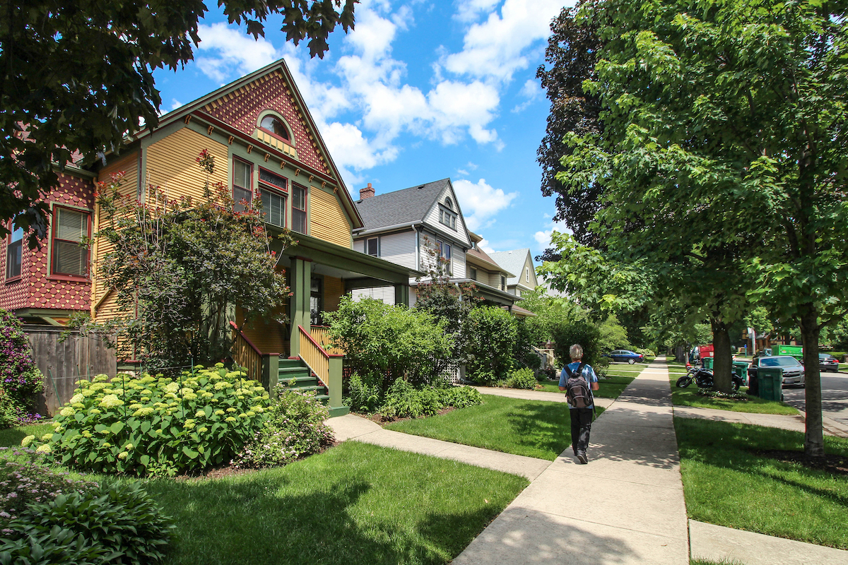 Large historic houses on a tree-lined street in Oak Park, Illinois.