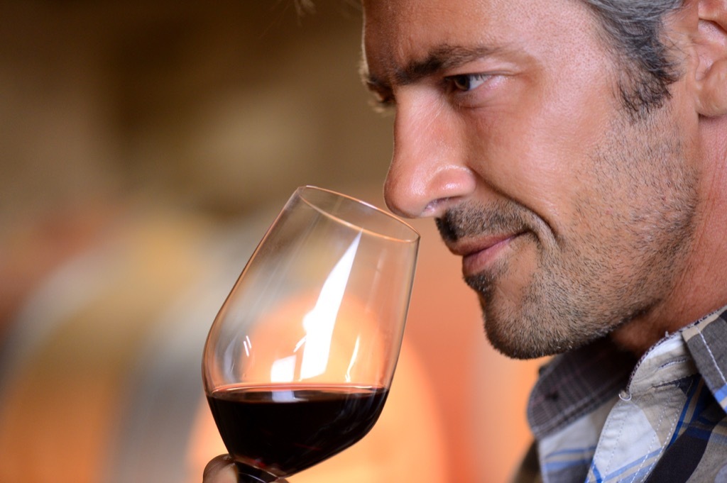 older man drinking wine, healthy sex after 40