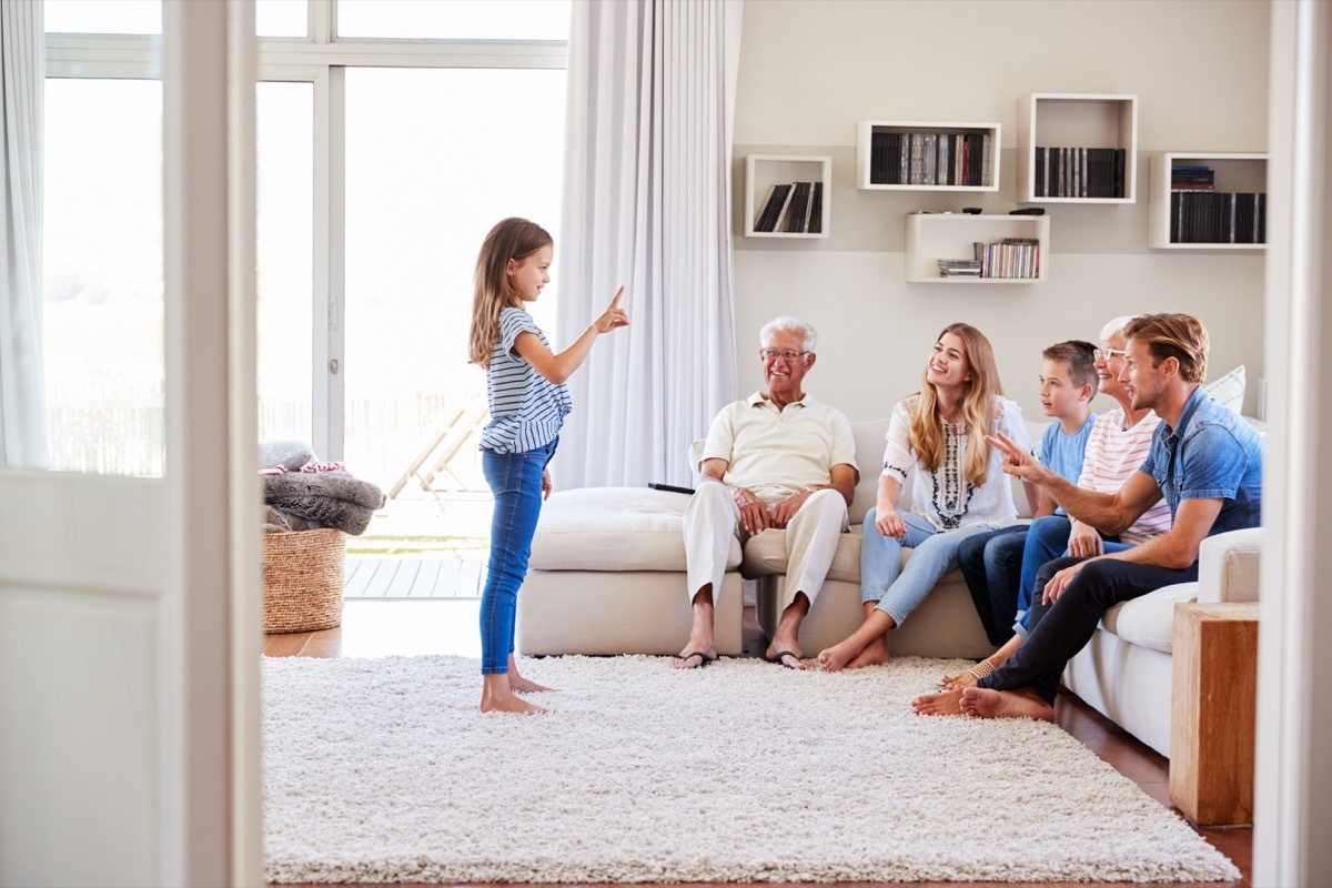 Family playing charades together