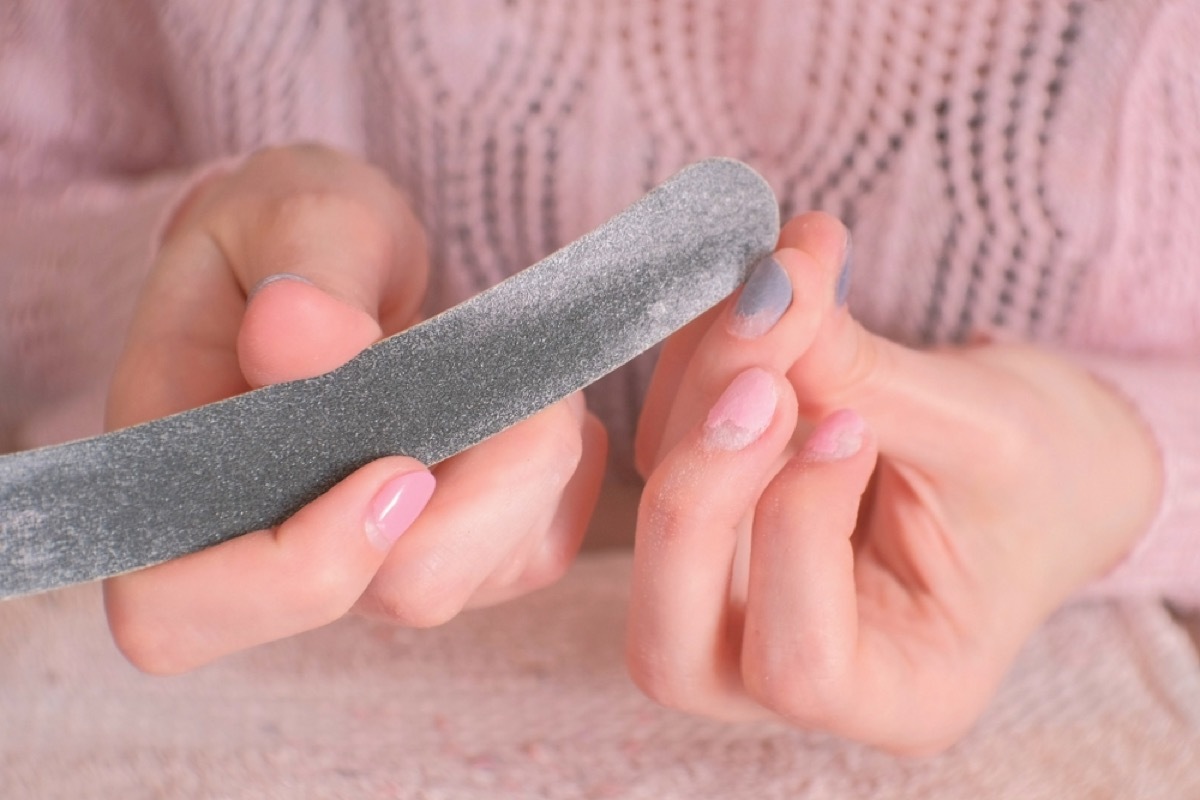 filing nails to remove gel polish