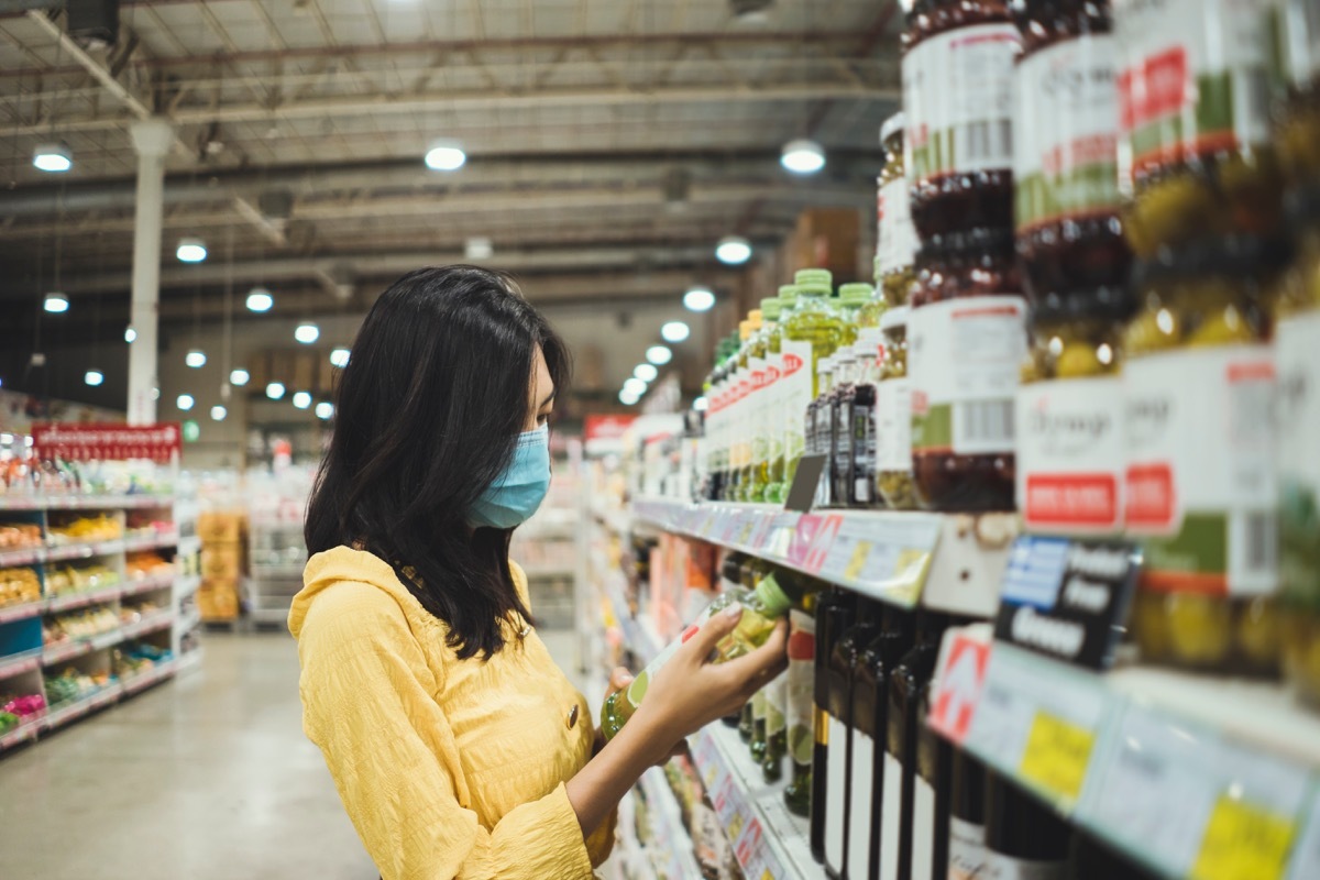 Woman looking at food packaging