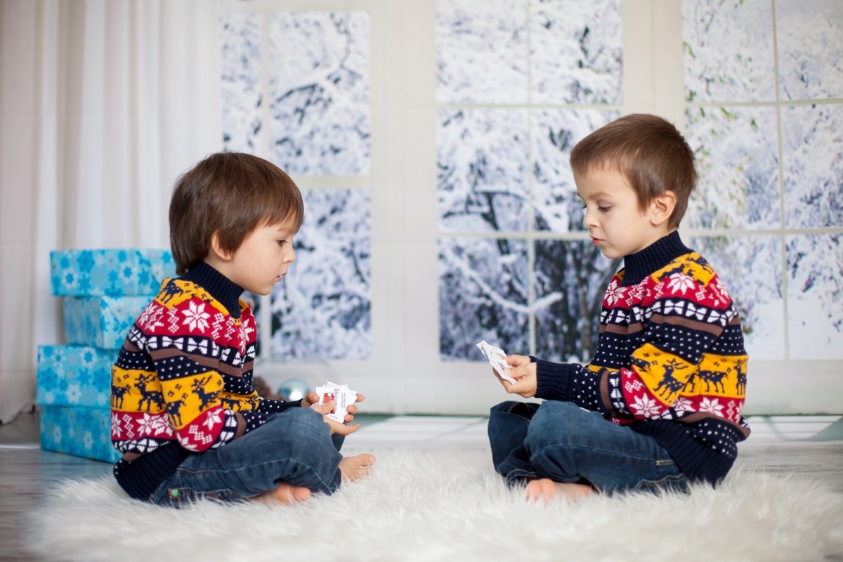 two brothers playing cards christmas morning