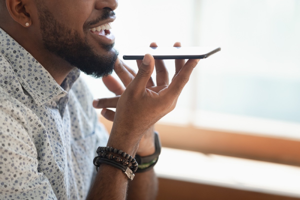 black man talking on speakerphone, rude behavior