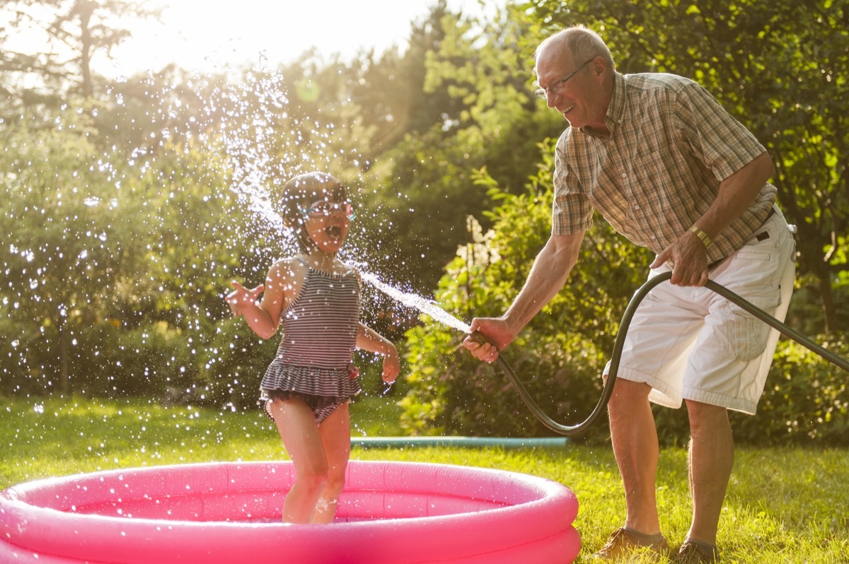 Grandpa playing with granddaughter summer 