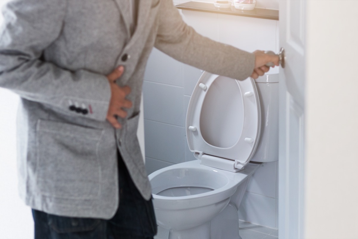 Man leaving toilet uncomfortable