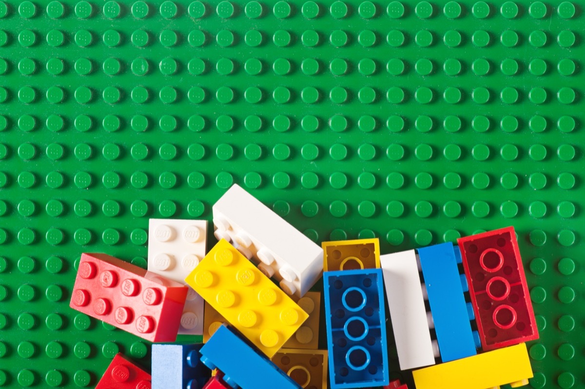 Albuquerque, USA - December 5, 2011: Colorful, old lego bloks on a pile. Studio shot. Lego, consists of colorful interlocking plastic bricks and an accompanying array of gears, minifigures and various other parts. Lego bricks can be assembled and connected in many ways, to construct such objects as vehicles, buildings, and even working robots. Anything constructed can then be taken apart again, and the pieces used to make other objects. The toys were originally designed in the 1940s in Denmark and have achieved an international appeal.