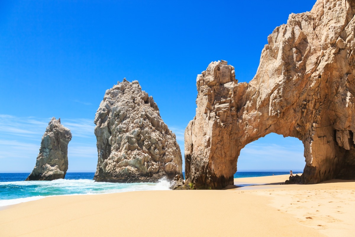 rock arch formations on a beach in cabo san lucas