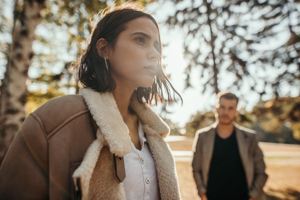 woman looking into the distance after talking with boyfriend