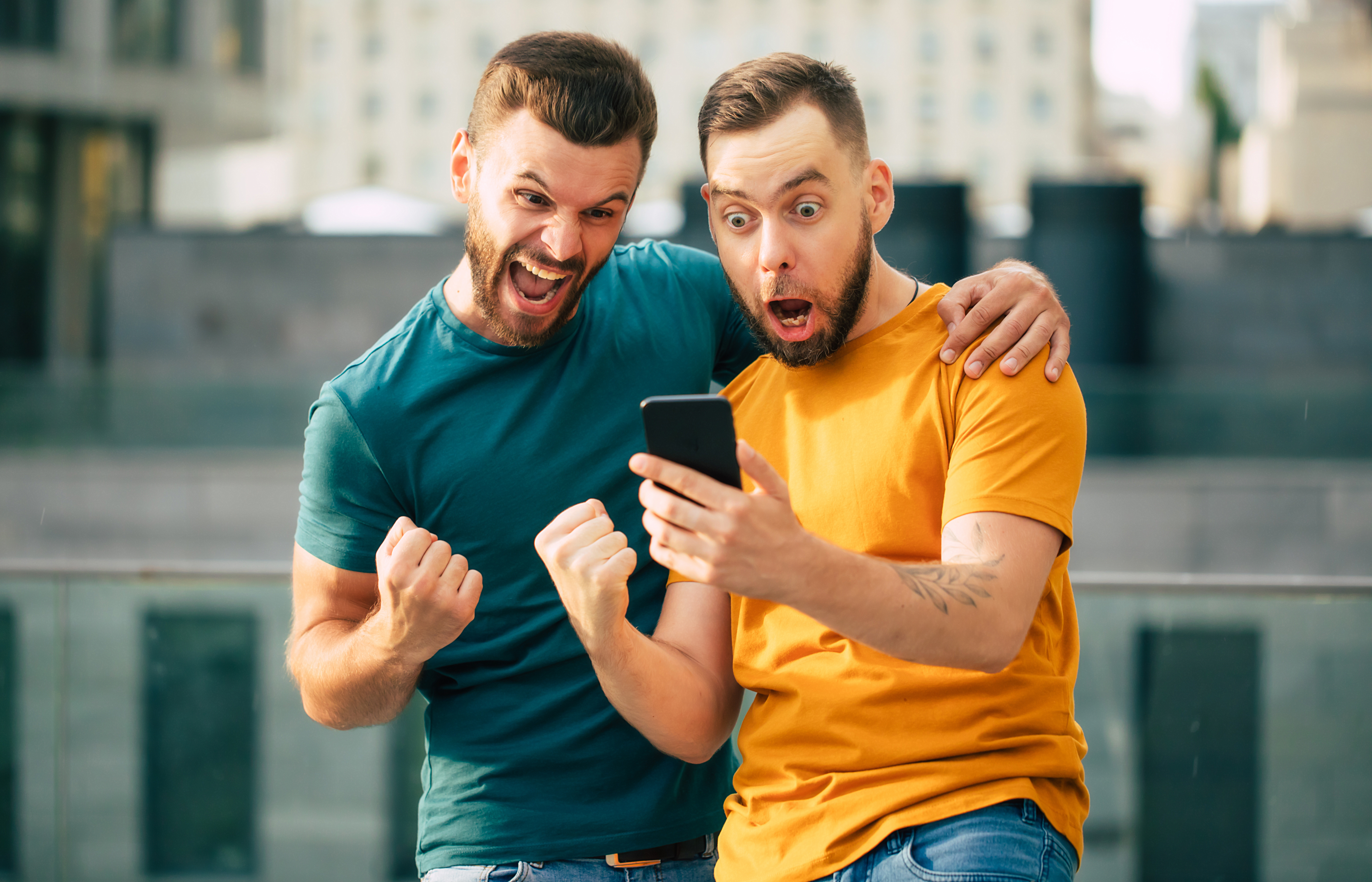 men having fun looking at their phone