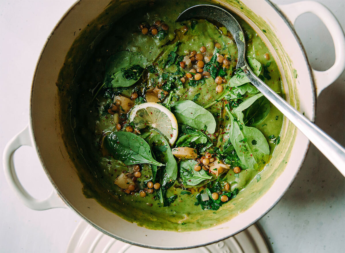 dutch oven filled with green lentil stew