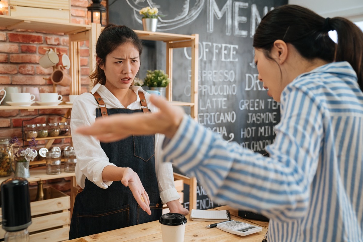 woman yelling at a barista in a coffee shop