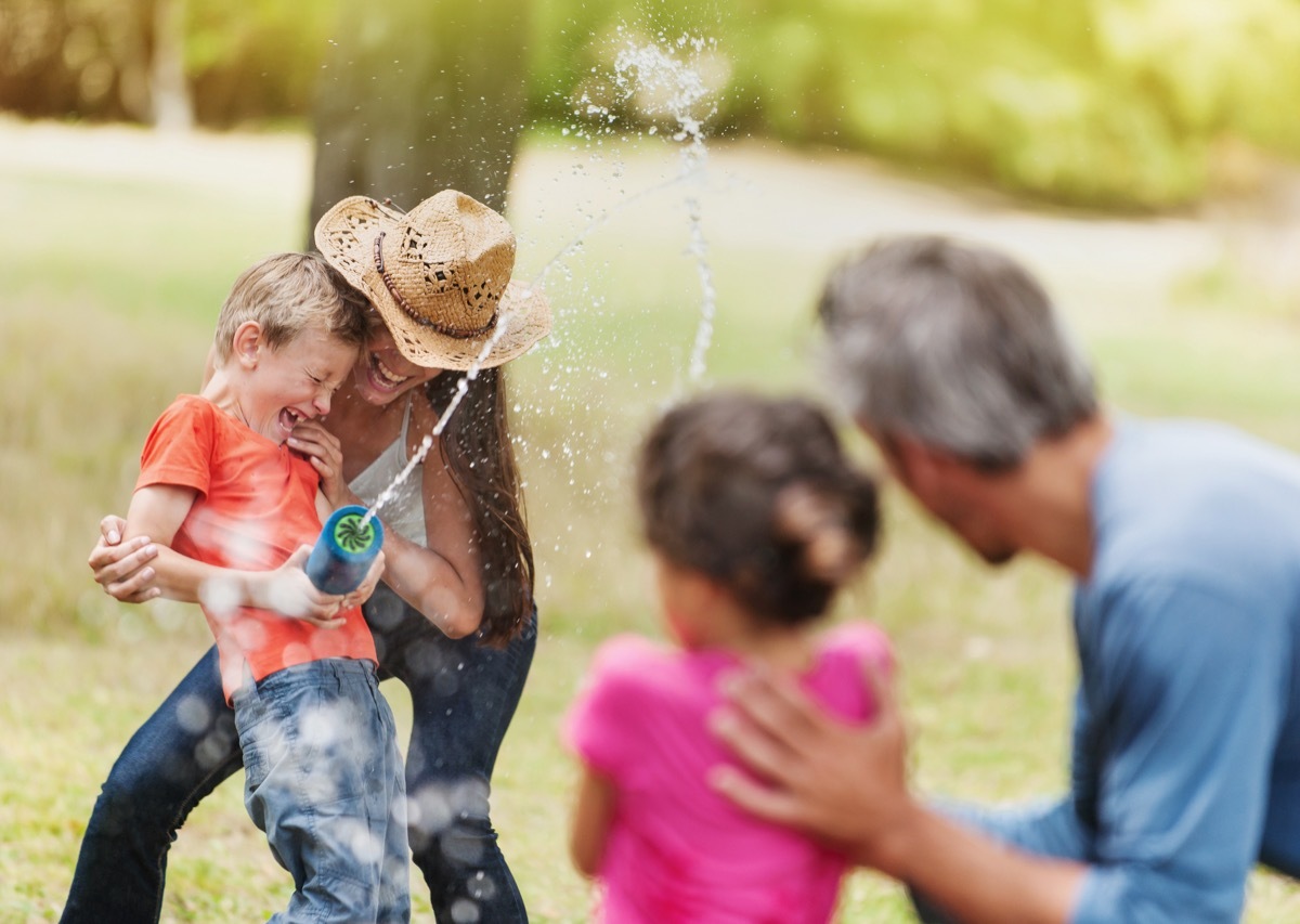 Family playing with water guns