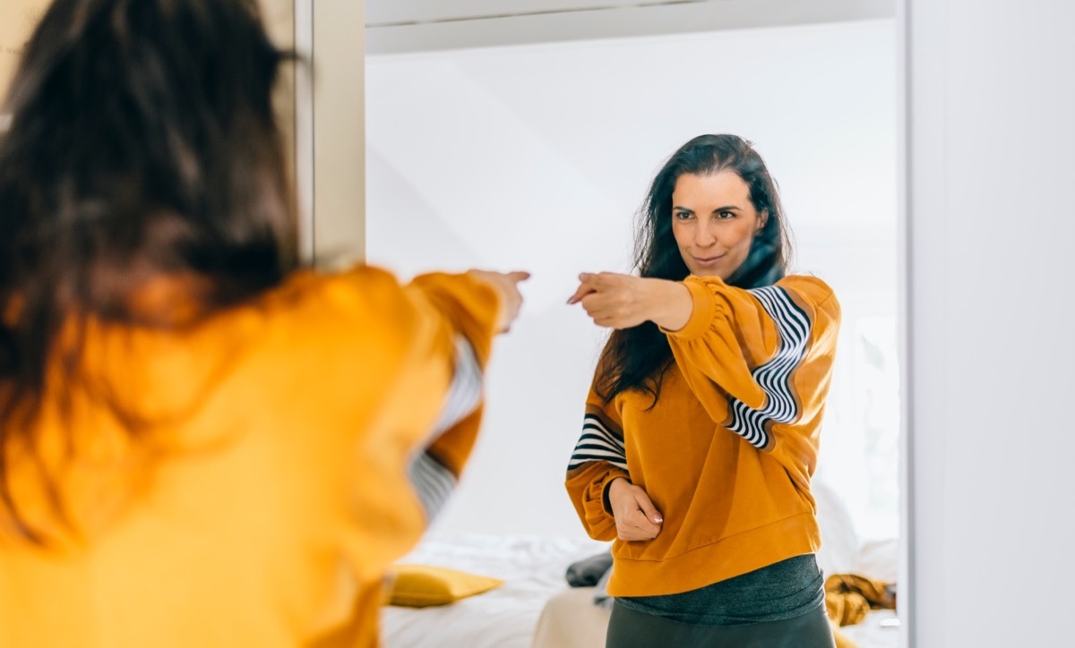 motivated woman doing affirmations in the mirror