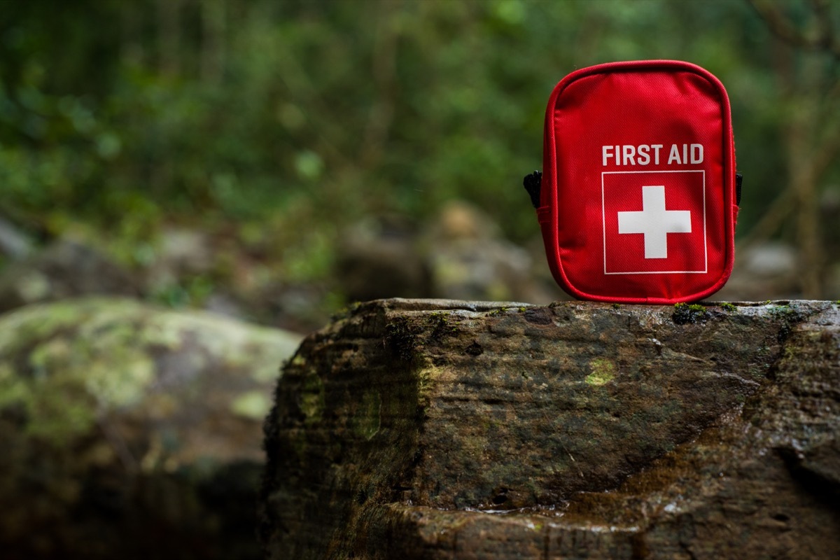 first aid kit bag on stone in nature - Image