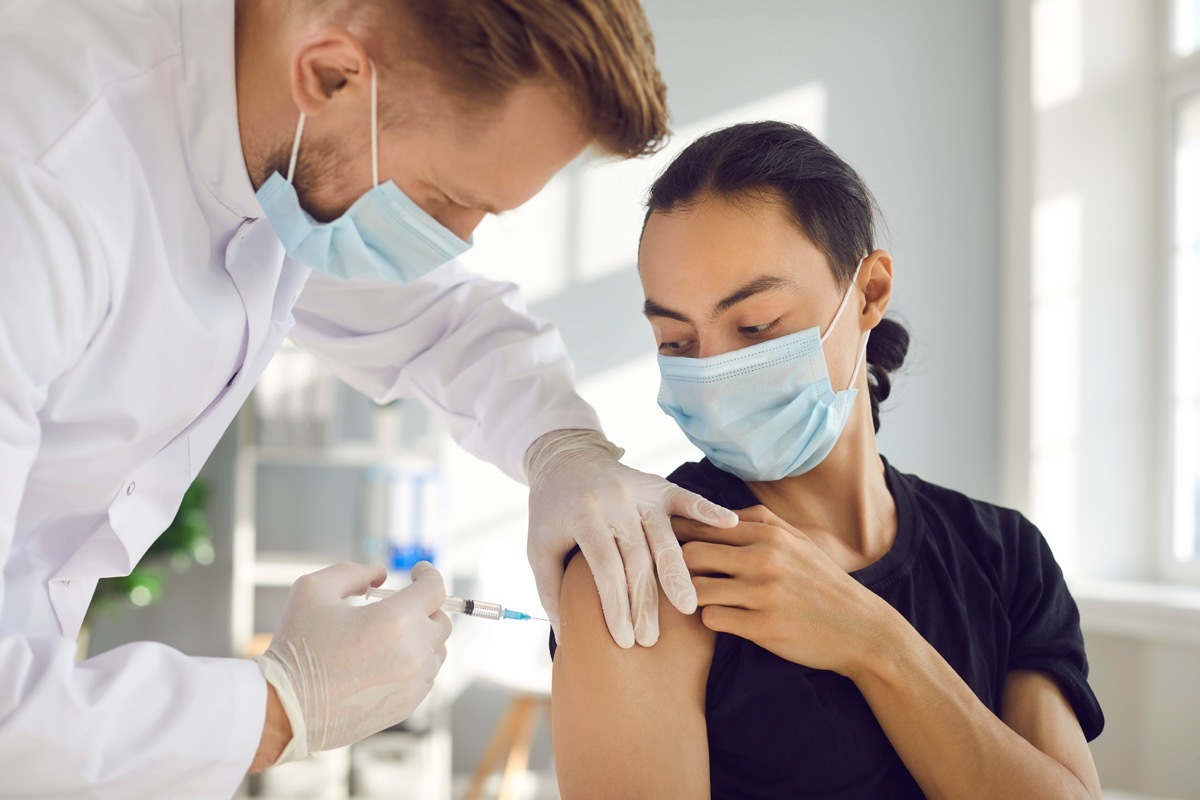 Woman getting COVID vaccine