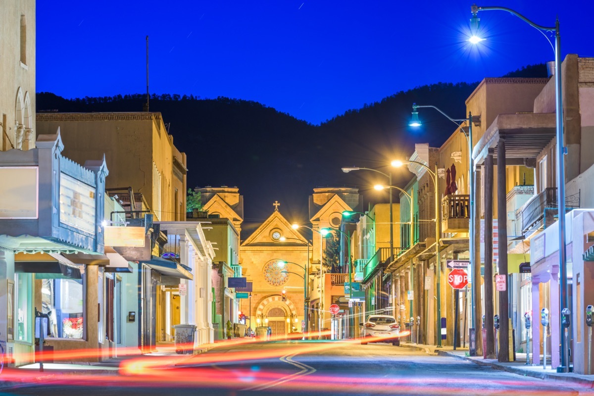 buildings and an empty street in downtown Santa Fe, New Mexico at night