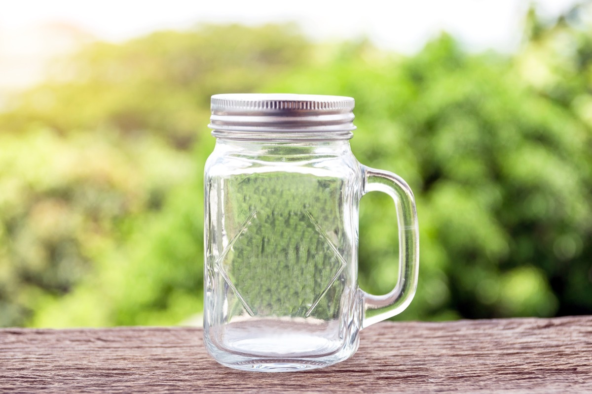 empty mason jar sitting on a stoop