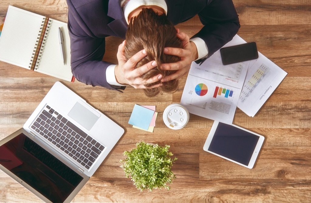 Man stressed at work, first heart attack