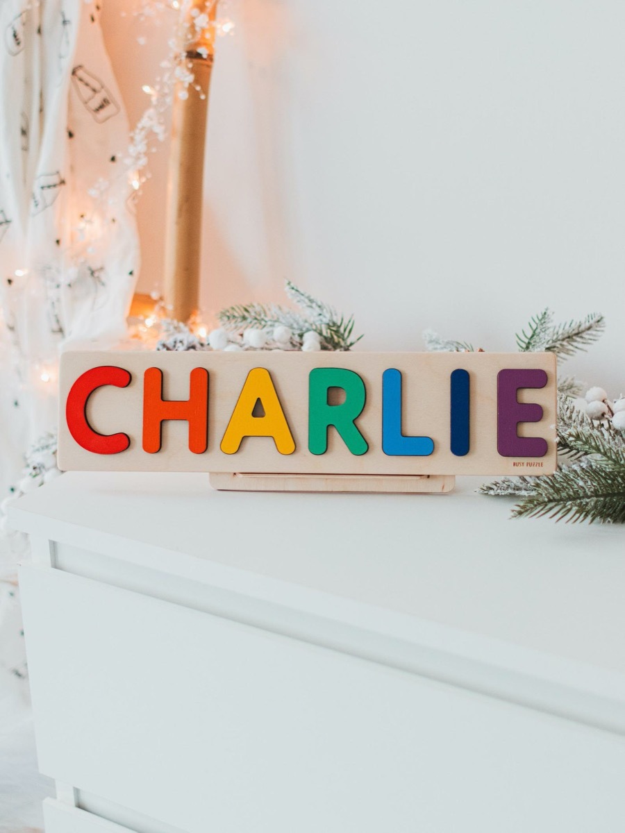 wooden puzzle with letters reading 