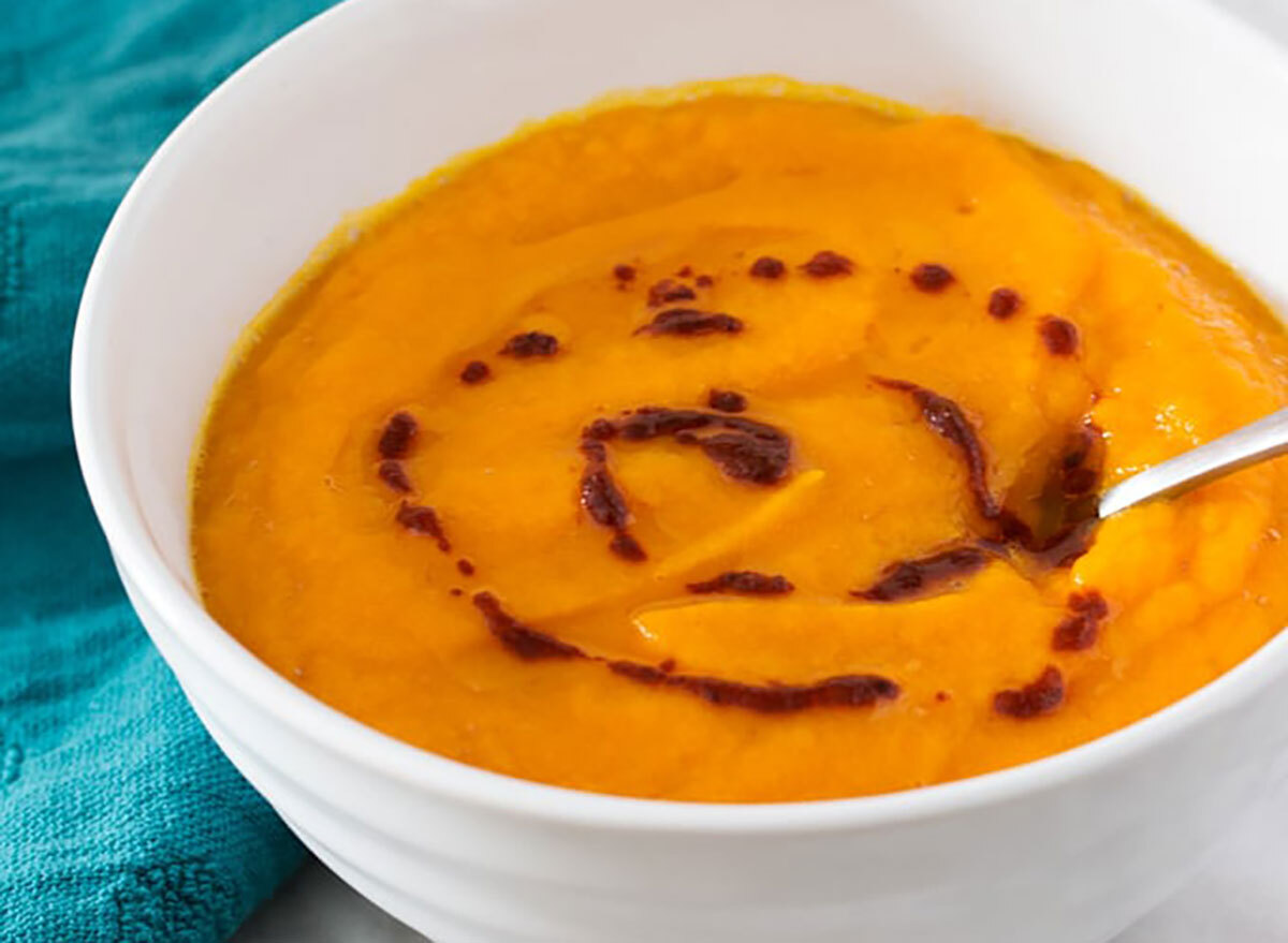 butternut squash carrot soup in white bowl