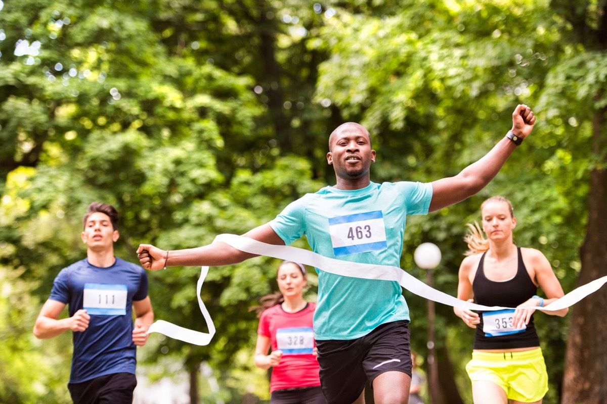 People running through the finish line of a race