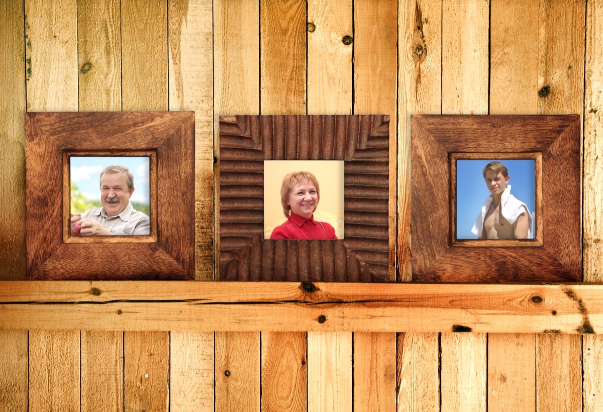 Wooden picture frames with family photographs in them