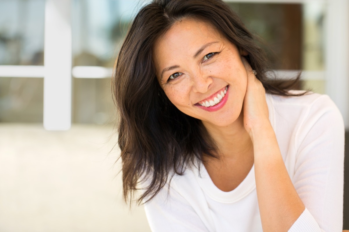 Confident Asian woman smiling