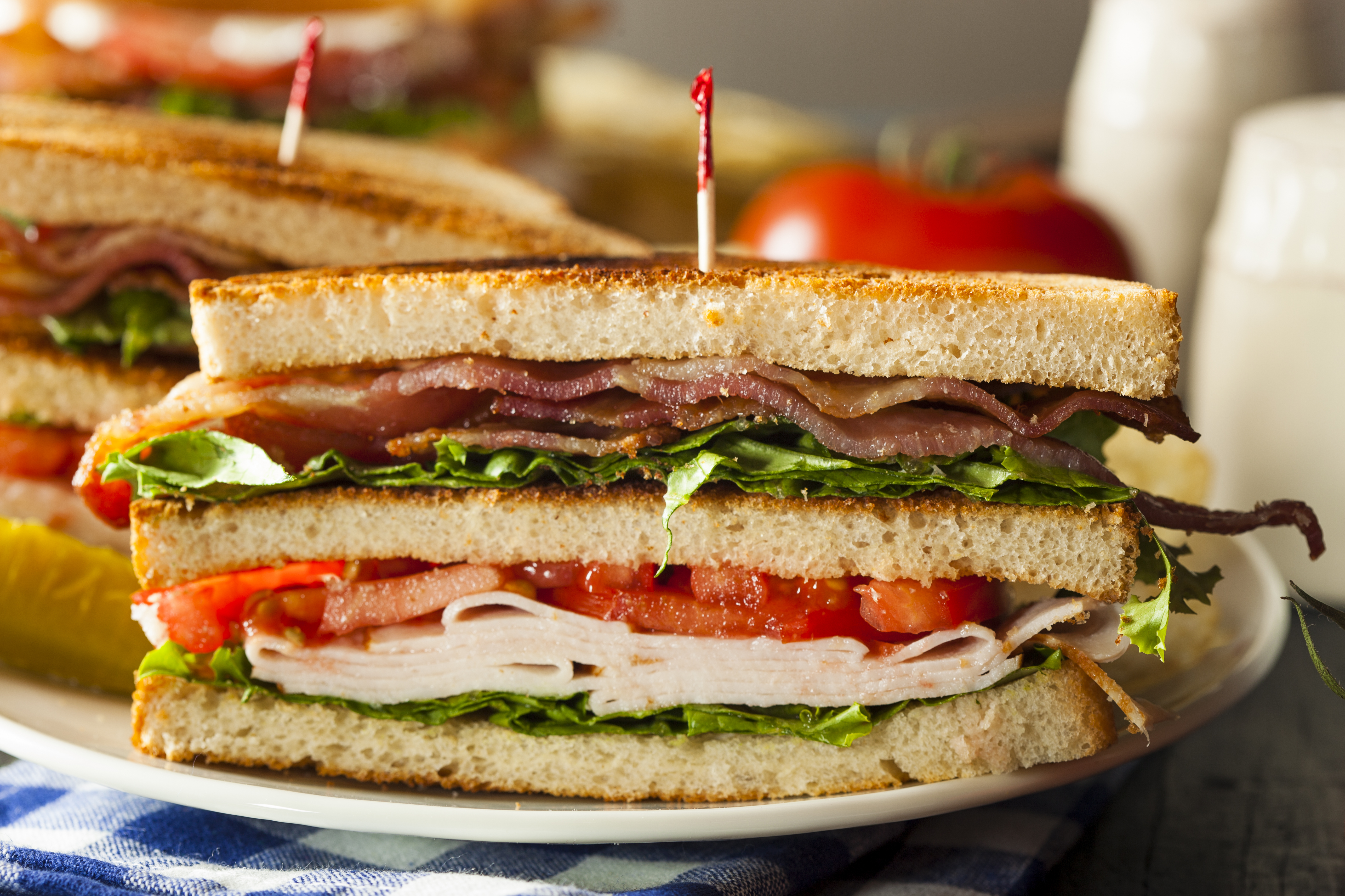 Turkey and Bacon Club Sandwich with Lettuce and Tomato