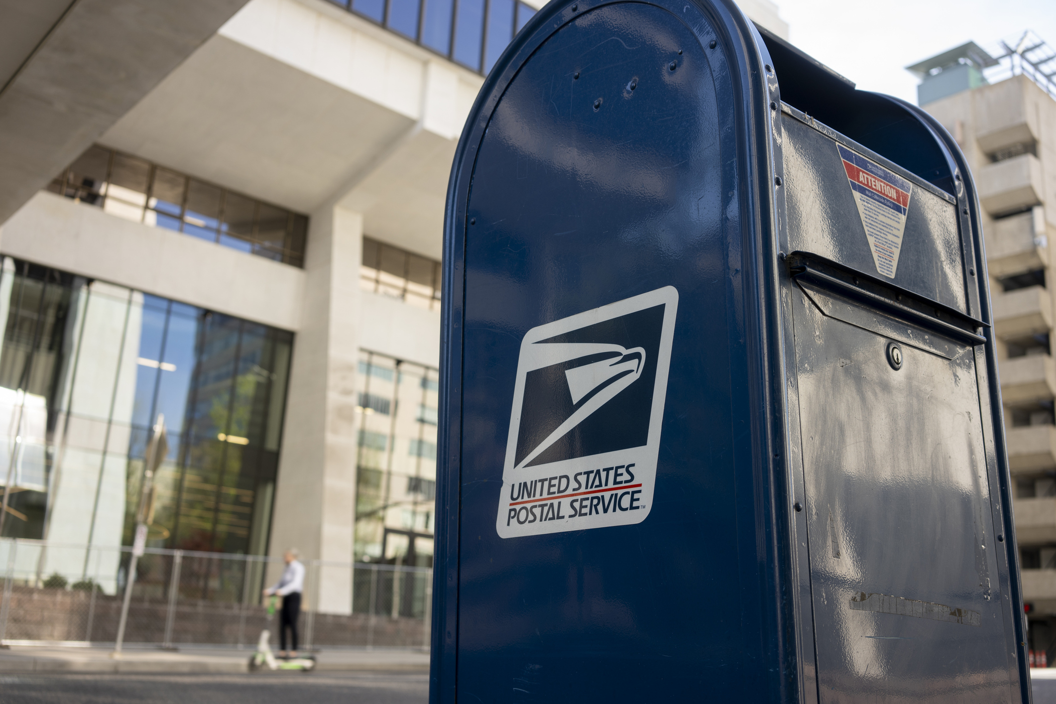 A close up of a USPS mailbox