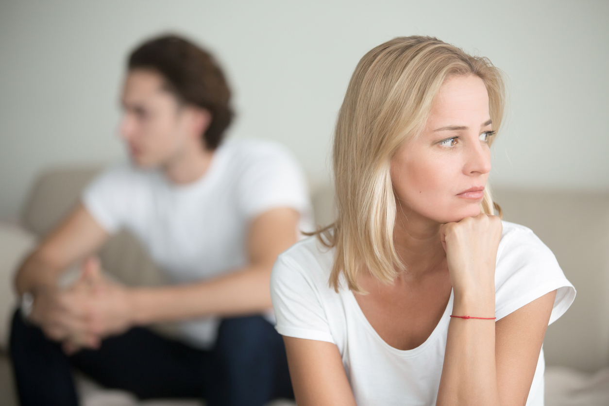 Serious sad woman thinking over a problem, man aside, meeting therapist, poor chance of getting pregnant after 40, unmet expectations, unable to handle family finances, interested in different things