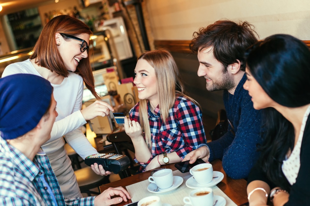 Friends Paying Restaurant Bill