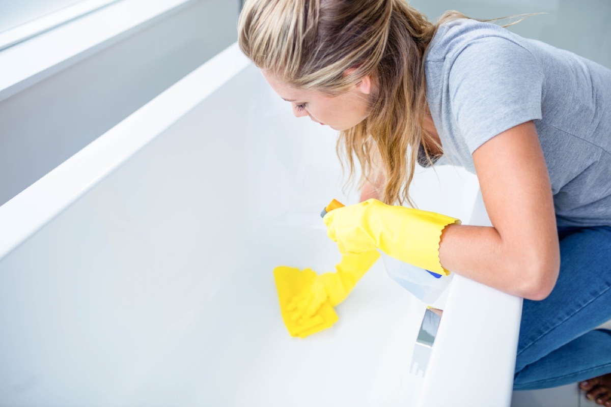 woman cleaning tub, new uses for cleaning products