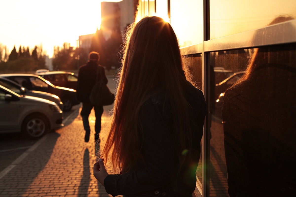 couple arguing in public at sunset