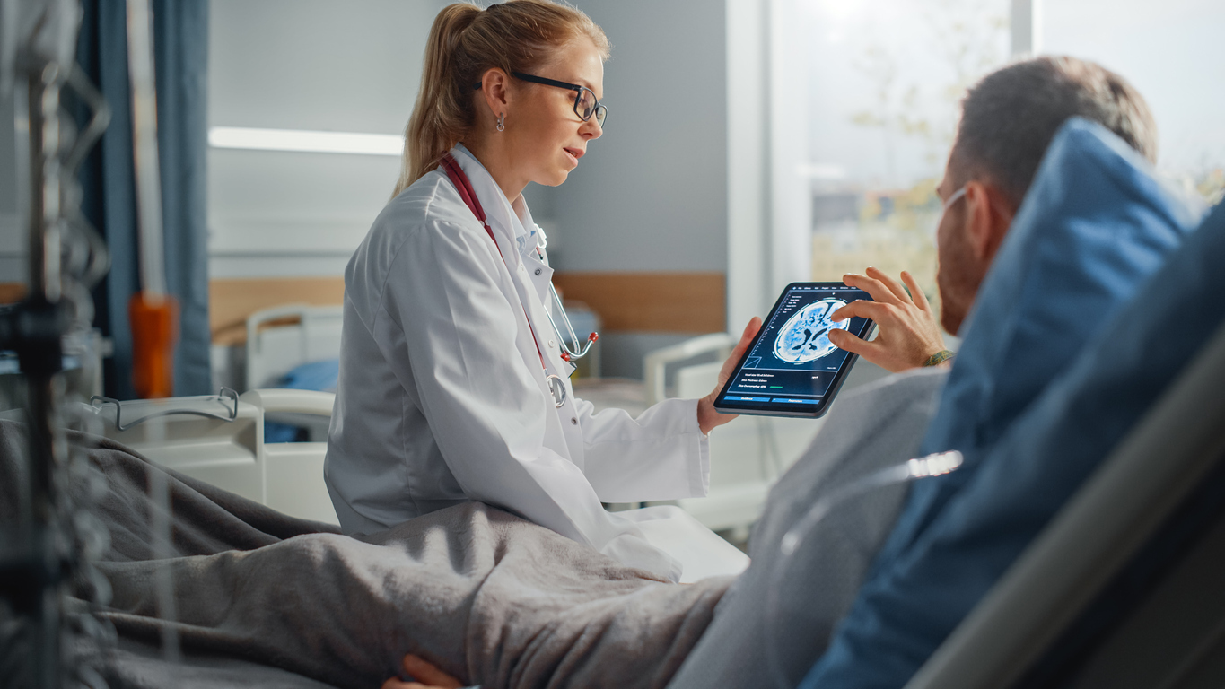 Doctor showing brain scan results to patient.