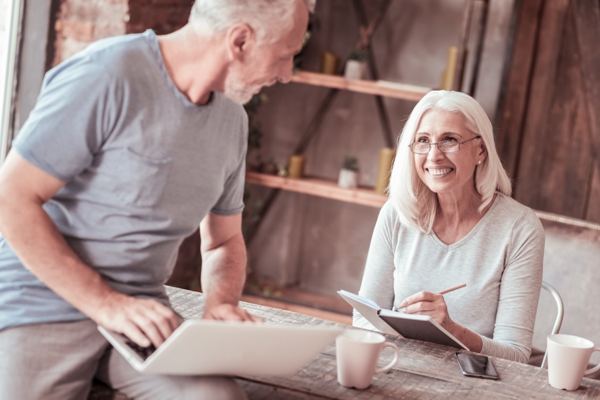 man and woman talking to each other in their home